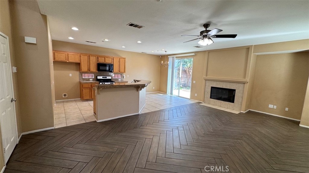 11332 Riverbury Court Riverside, CA 92505 - Photo 2 of 15 a view of a kitchen with a sink a refrigerator and a stove top oven