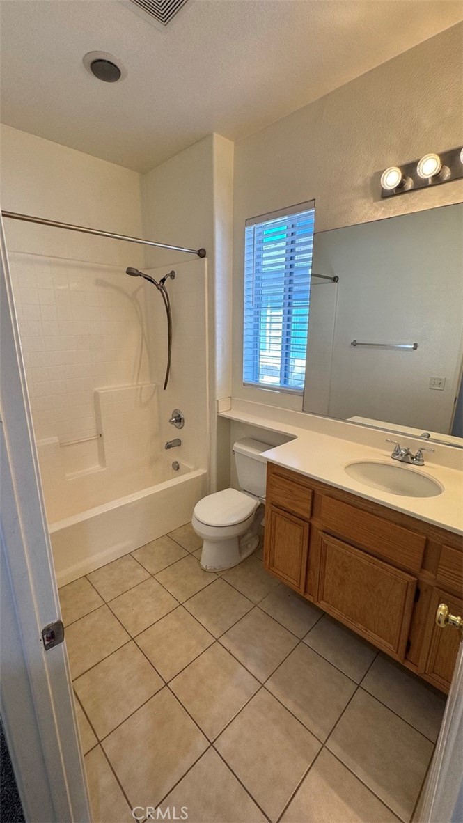 11332 Riverbury Court Riverside, CA 92505 - Photo 8 of 15 a bathroom with a granite countertop sink a toilet and shower