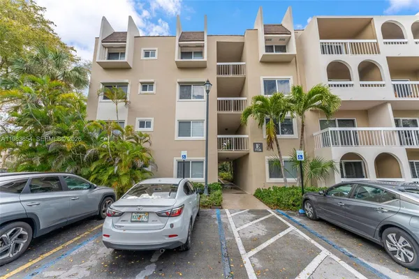 a front view of a house with parking space
