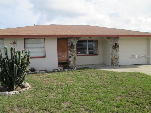 7331 Fireside Drive Port Richey, FL 34668 - Photo 1 of 1 a front view of house with yard