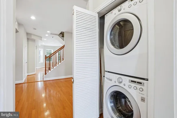 a view of a hallway with washer and dryer