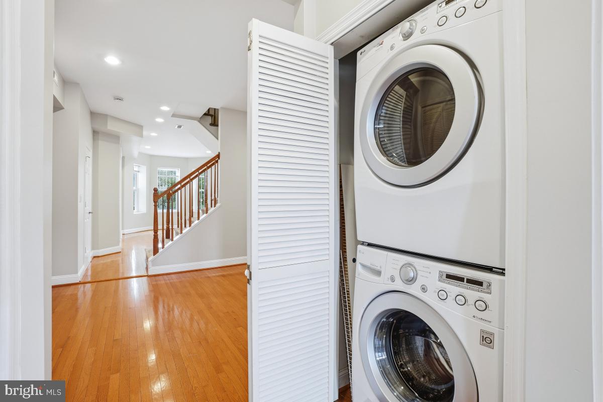 3117 11th Street Northwest Washington, DC 20010 - Photo 14 of 35 a view of a hallway with washer and dryer