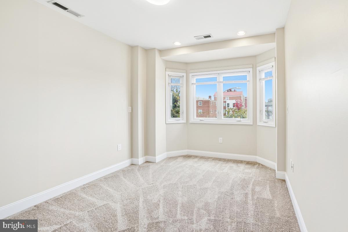 3117 11th Street Northwest Washington, DC 20010 - Photo 22 of 35 a view of an empty room with a window