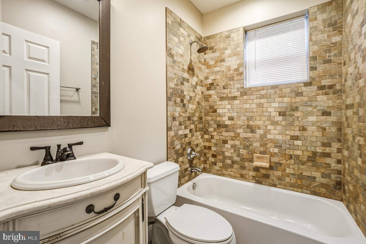 3117 11th Street Northwest Washington, DC 20010 - Photo 24 of 35 a bathroom with a sink toilet and shower