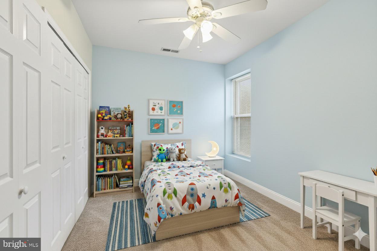 3117 11th Street Northwest Washington, DC 20010 - Photo 26 of 35 a bedroom with a bed and a chandelier