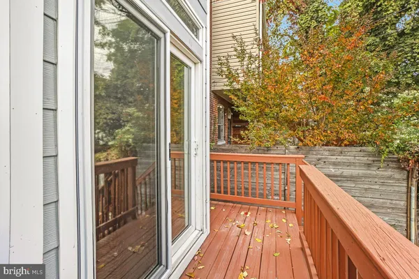 a view of balcony with wooden floor