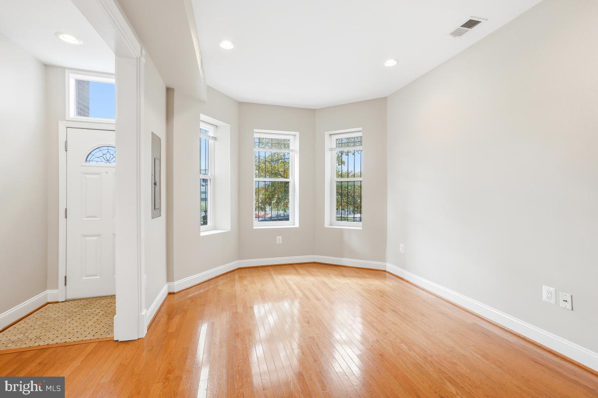 3117 11th Street Northwest Washington, DC 20010 - Photo 5 of 35 a view of empty room with wooden floor and fan