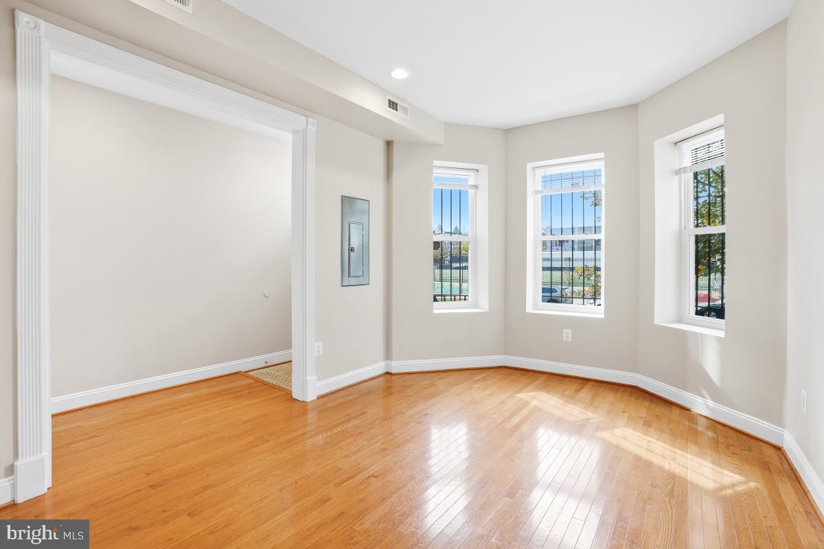 3117 11th Street Northwest Washington, DC 20010 - Photo 6 of 35 a view of empty room with wooden floor and fan