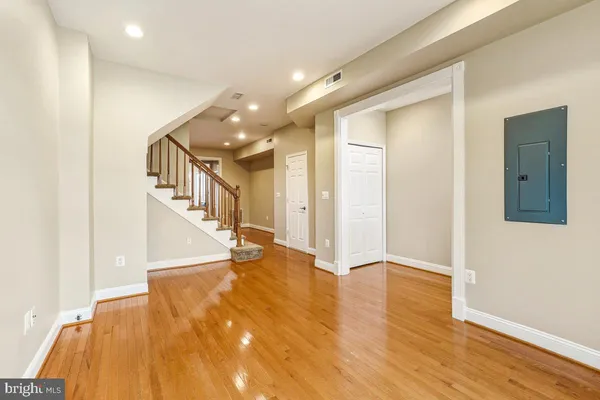 a view of entryway with wooden floor