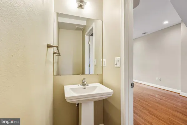 a bathroom with a sink and mirror