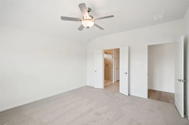 a view of a livingroom with a ceiling fan