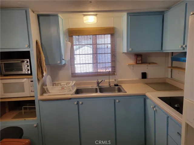 a kitchen with a sink and cabinets
