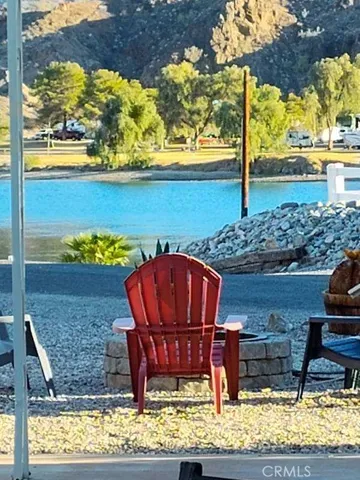 a view of a balcony with chair and table