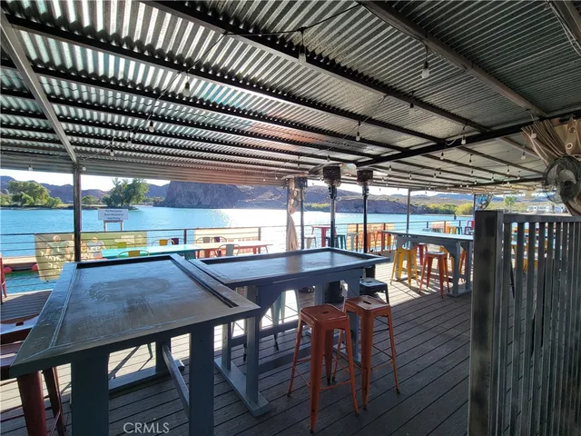 a view of a chairs and table in the patio