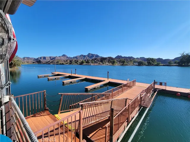 a view of a balcony with lake view and mountain view