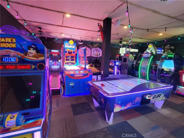 a view of a room with pool table and a flat screen tv
