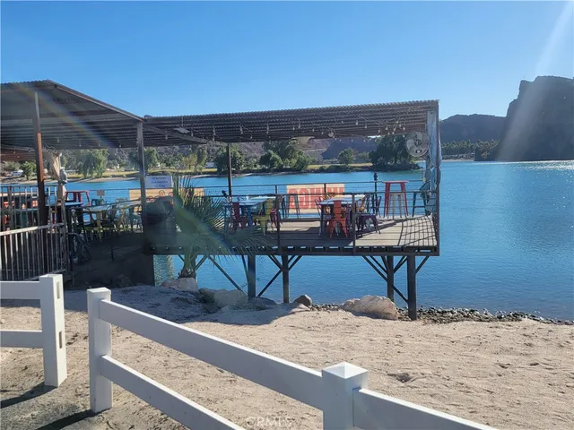 a view of a terrace with wooden floor and outdoor seating