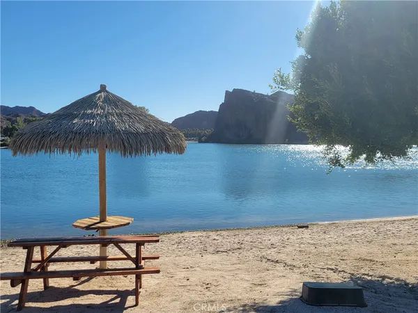 a fire hydrant in the middle of a beach