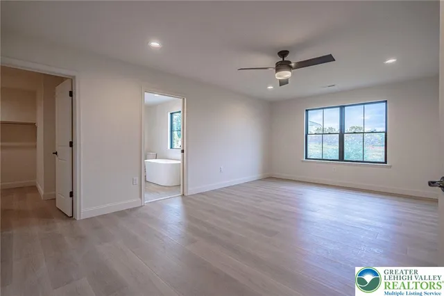 a kitchen with stainless steel appliances granite countertop a sink a stove and cabinets