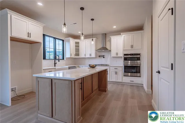 a view of a room with window and wooden floor
