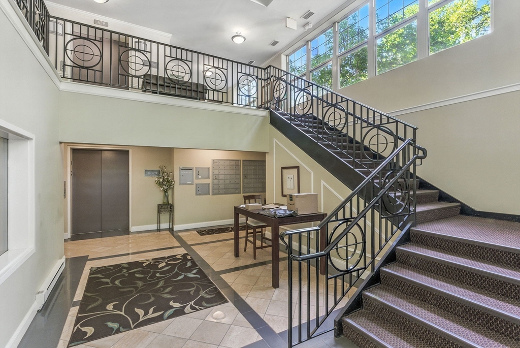 248 Albion Street, Unit 211 Wakefield, MA 01880 - Photo 3 of 24 a view of entryway livingroom and hall