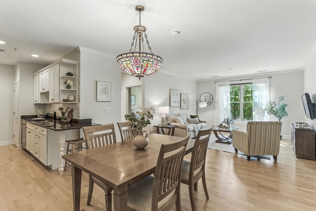 248 Albion Street, Unit 211 Wakefield, MA 01880 - Photo 4 of 24 a view of a dining room with furniture window and wooden floor