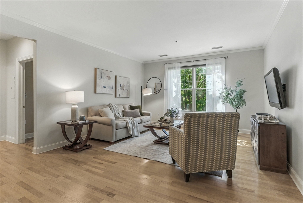 248 Albion Street, Unit 211 Wakefield, MA 01880 - Photo 10 of 24 a living room with furniture and a large window