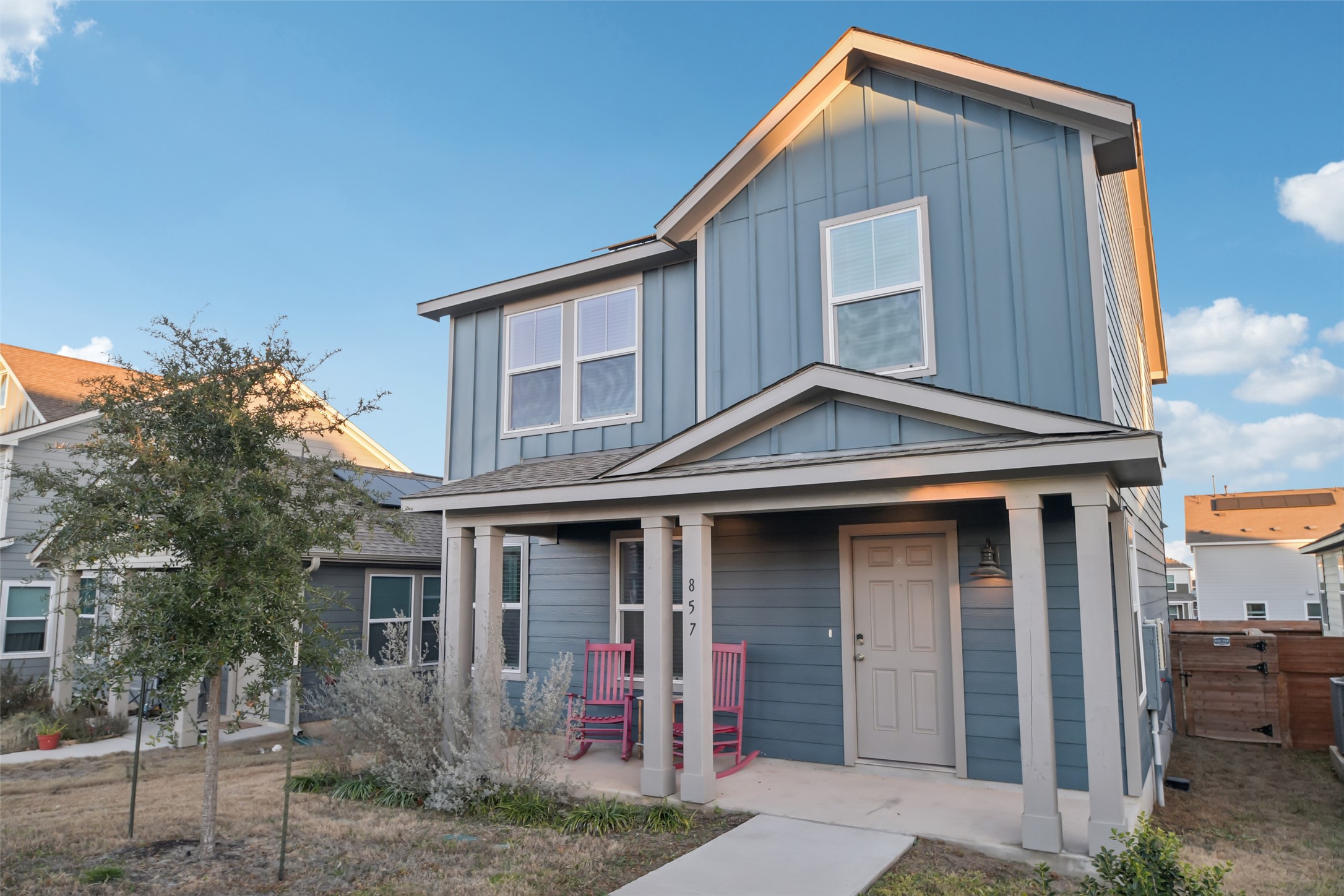 857 Powell Kyle, TX 78640 - Photo 2 of 28 View of front of house with board and batten siding and a porch