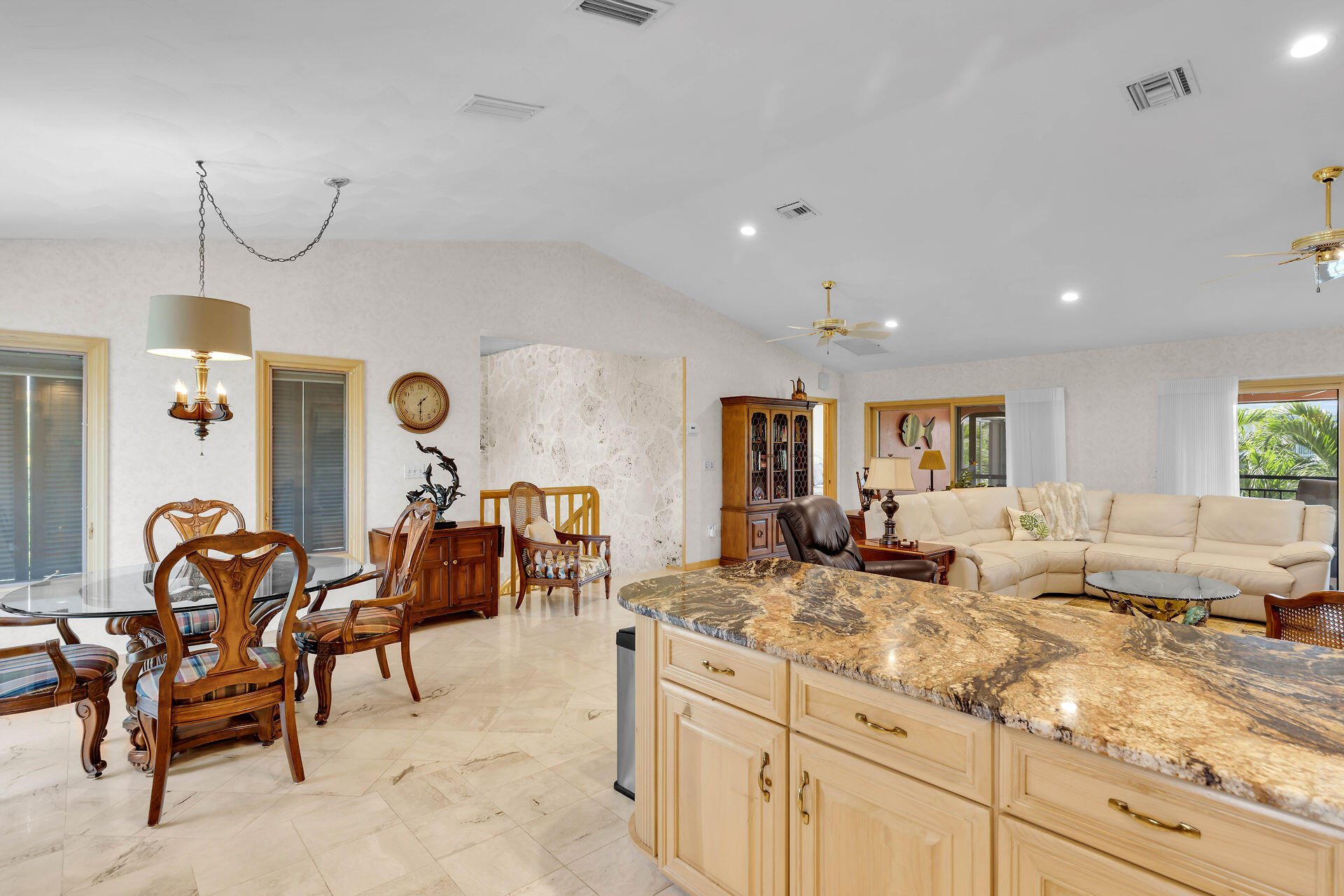 701 12th Street Key Colony Beach, FL 33051 - Photo 19 of 48 a living room with granite countertop furniture and a couch