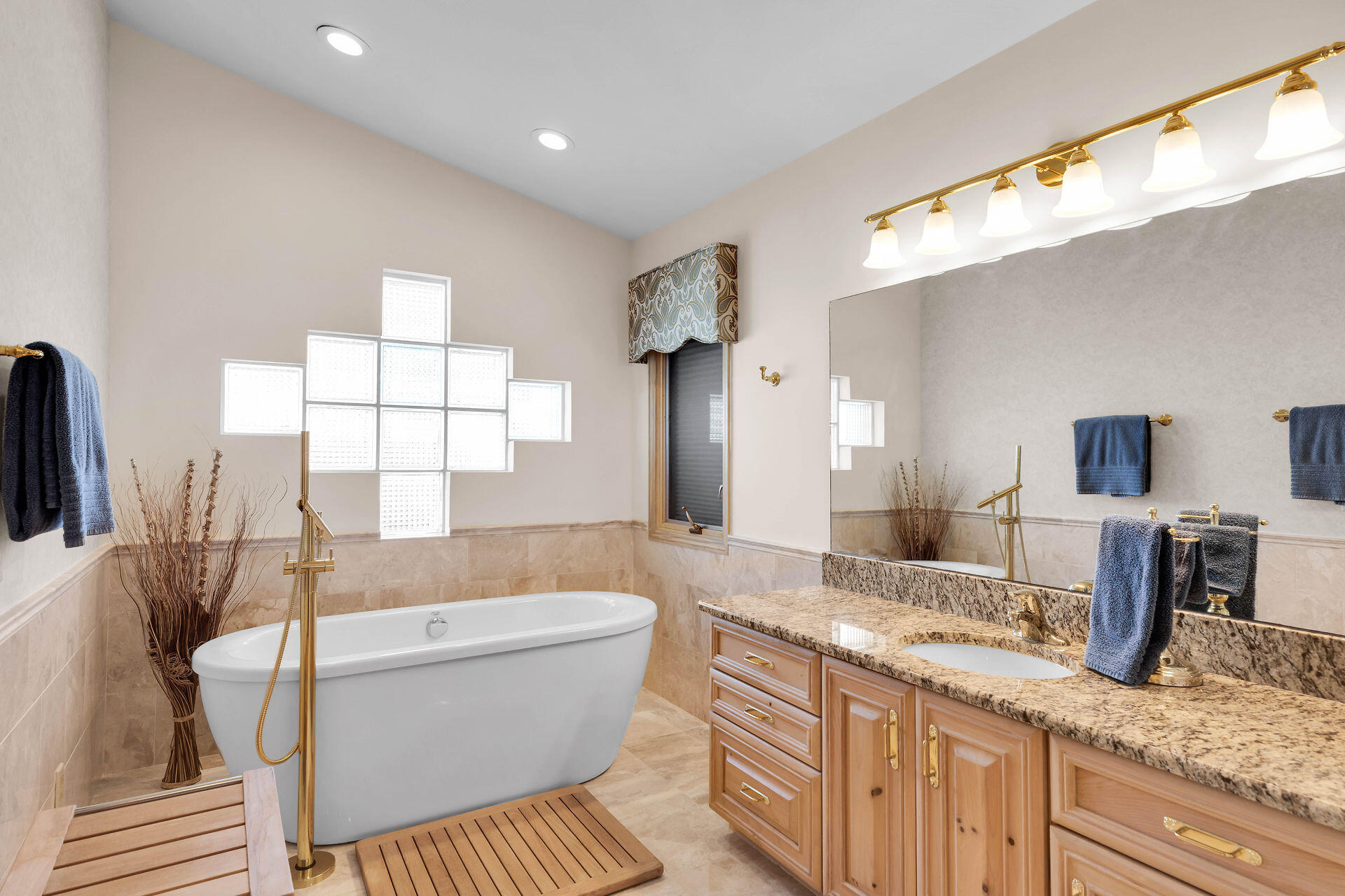 701 12th Street Key Colony Beach, FL 33051 - Photo 29 of 48 a spacious bathroom with a granite countertop sink and a mirror