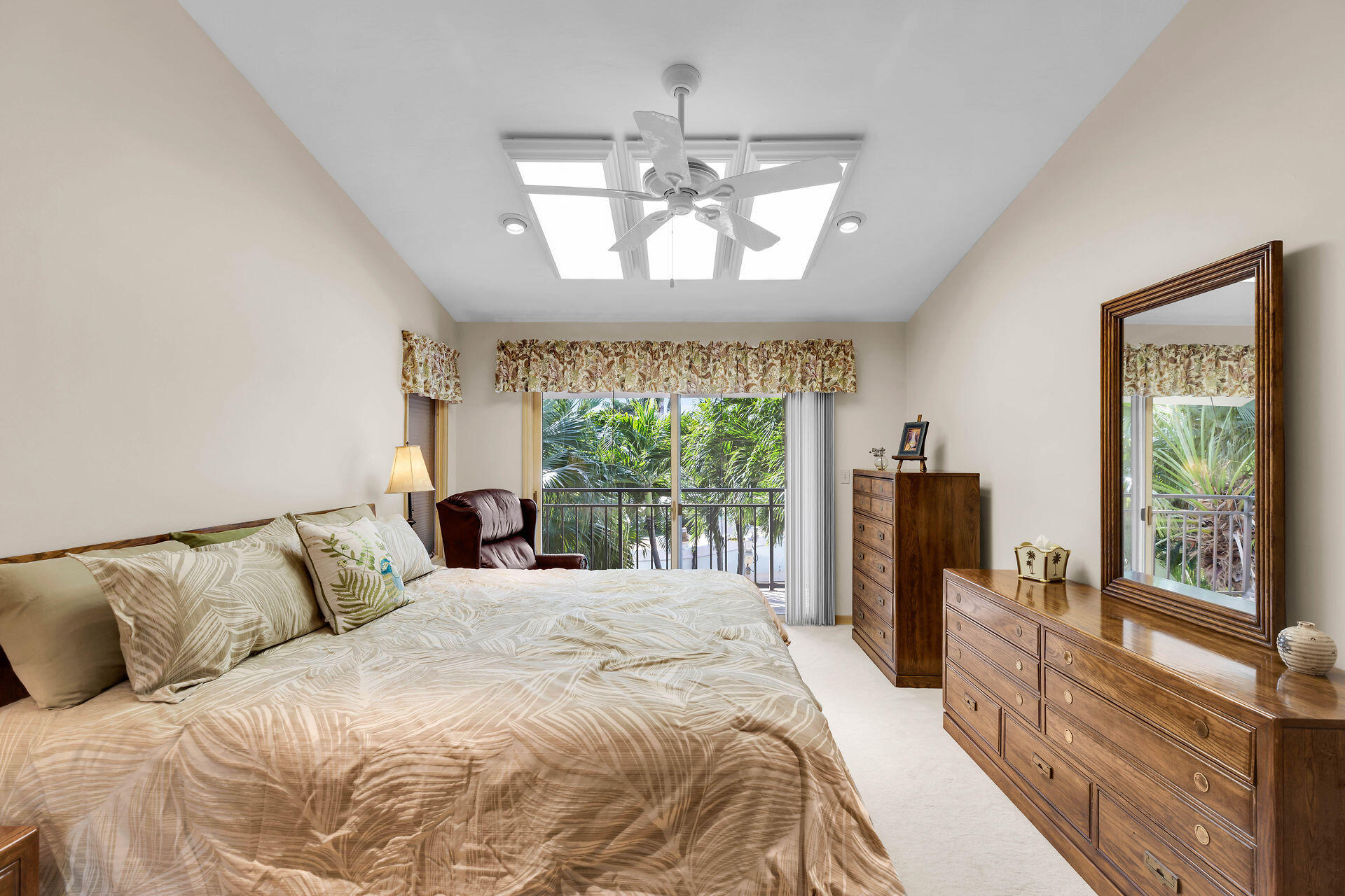 701 12th Street Key Colony Beach, FL 33051 - Photo 36 of 48 a bedroom with a large bed and a chandelier