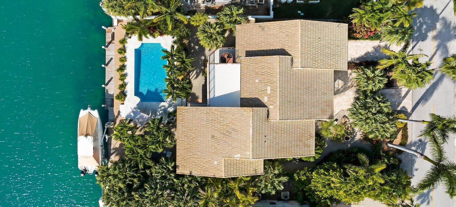 701 12th Street Key Colony Beach, FL 33051 - Photo 48 of 48 an aerial view of a house with a yard and trees