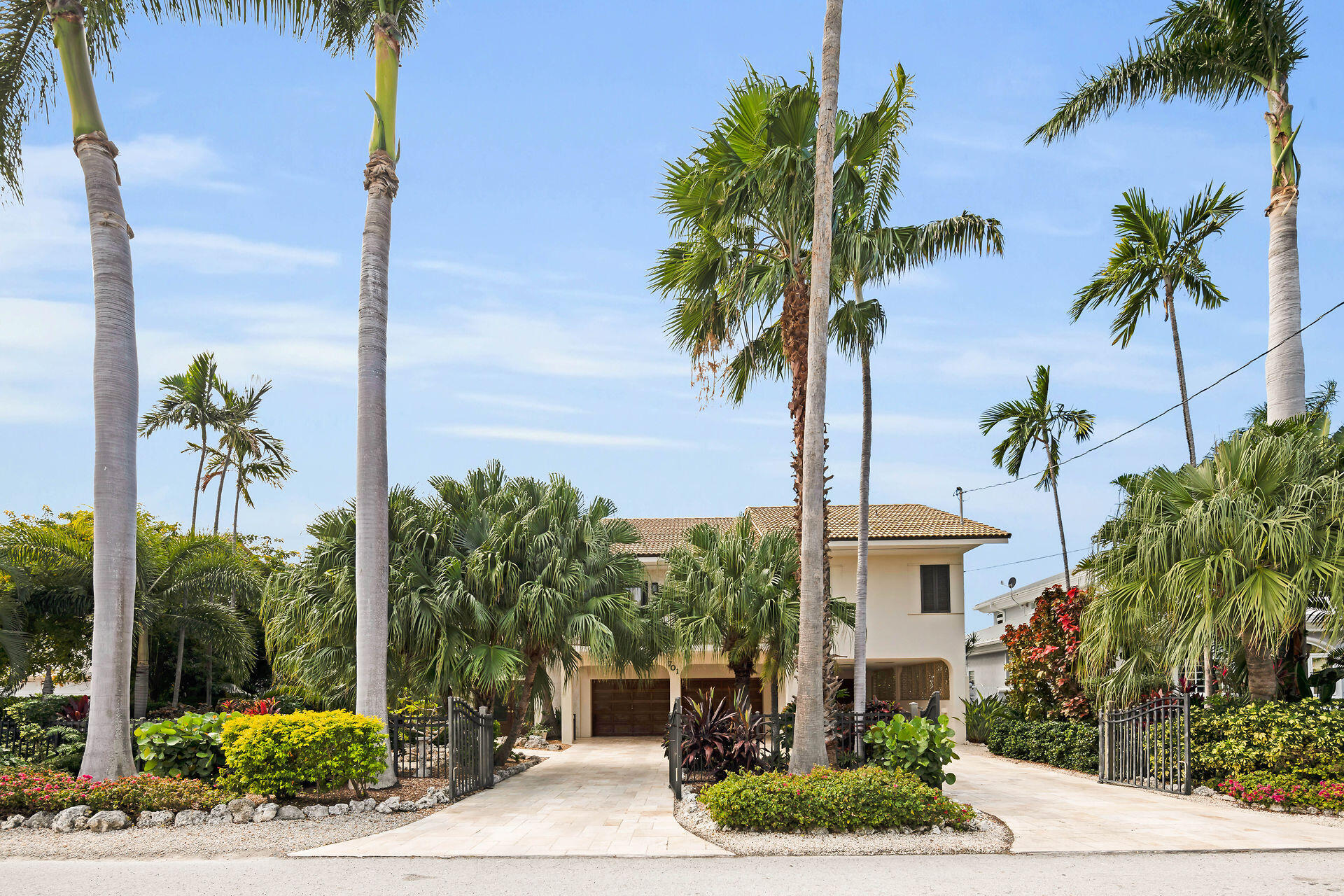 701 12th Street Key Colony Beach, FL 33051 - Photo 5 of 48 a view of a palm trees front of a house
