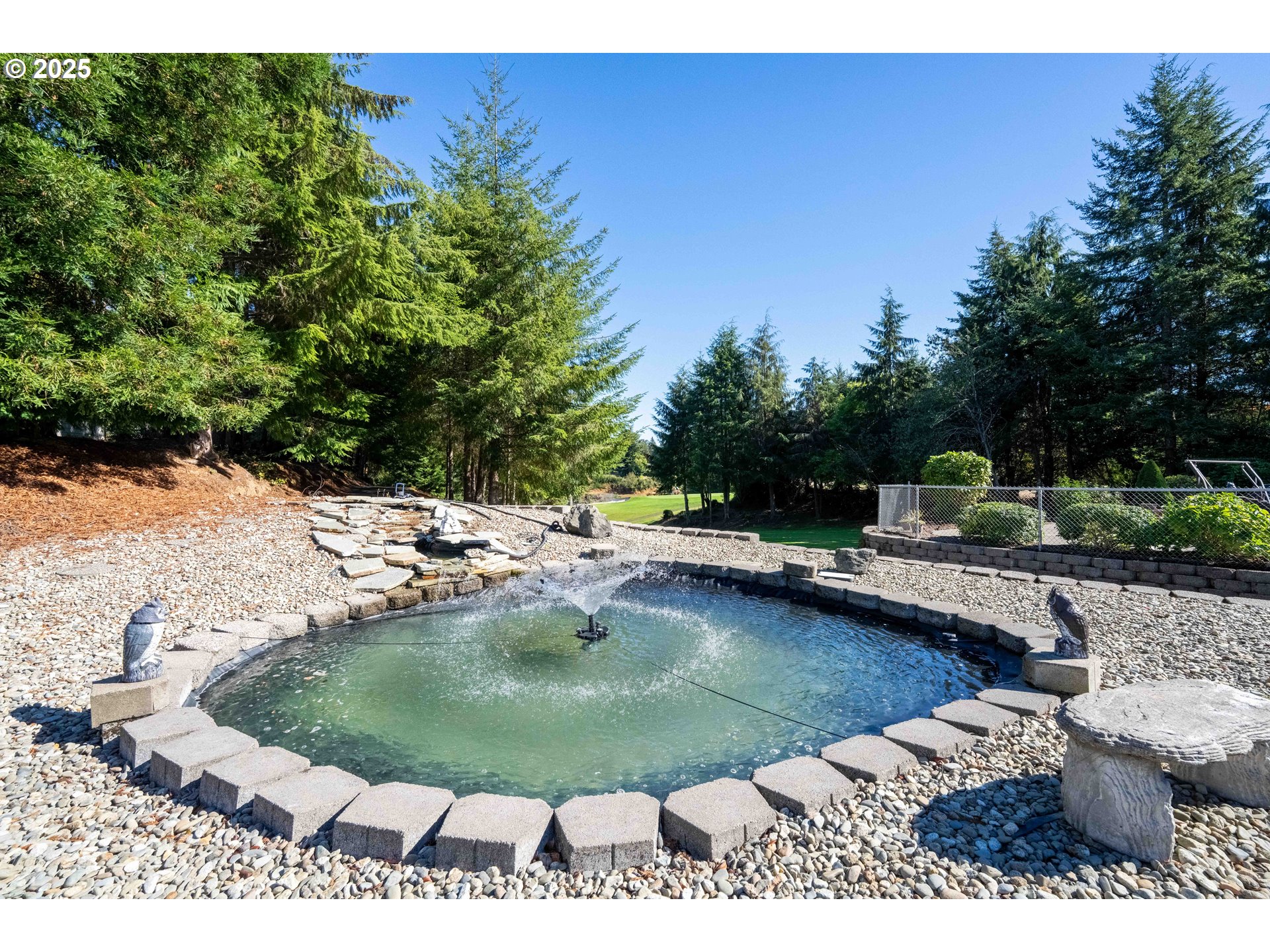 729 Ranch Road Reedsport, OR 97467 - Photo 15 of 48 a view of a swimming pool with a chair and tables