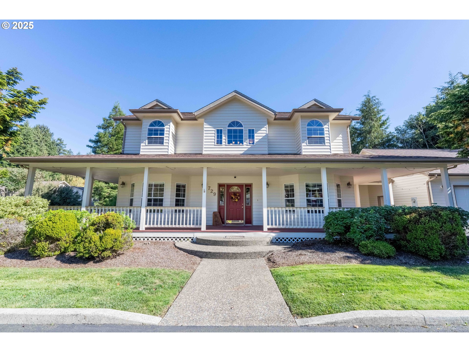 729 Ranch Road Reedsport, OR 97467 - Photo 19 of 48 a view of house and outdoor space with yard