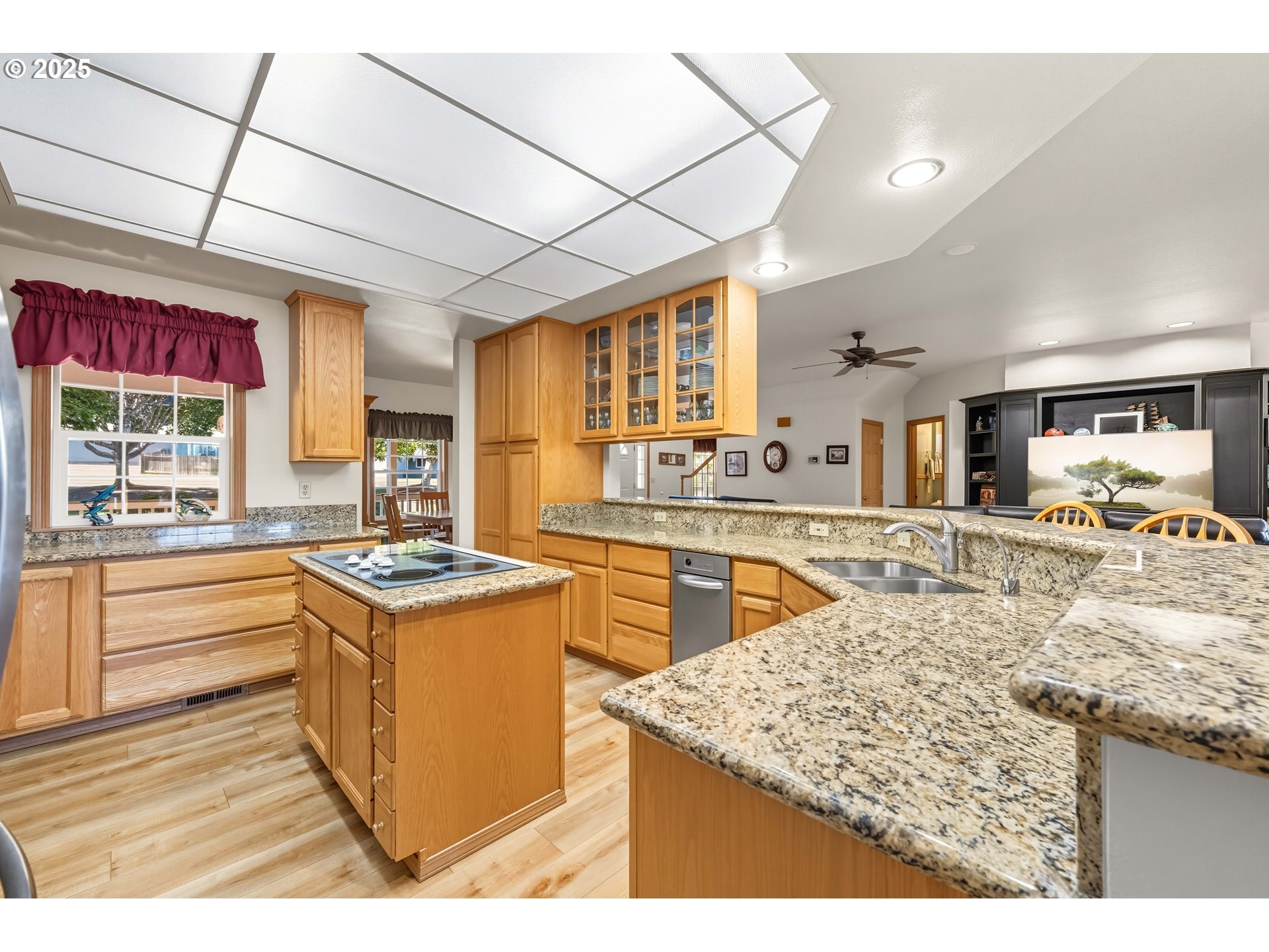729 Ranch Road Reedsport, OR 97467 - Photo 23 of 48 a kitchen with stainless steel appliances granite countertop sink stove and large window