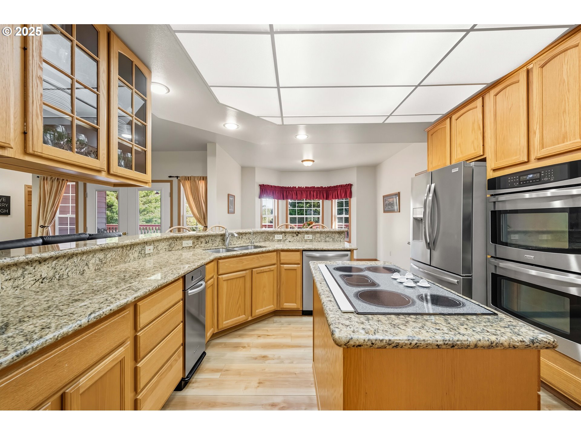 729 Ranch Road Reedsport, OR 97467 - Photo 24 of 48 a kitchen with stainless steel appliances granite countertop a sink stove and cabinets