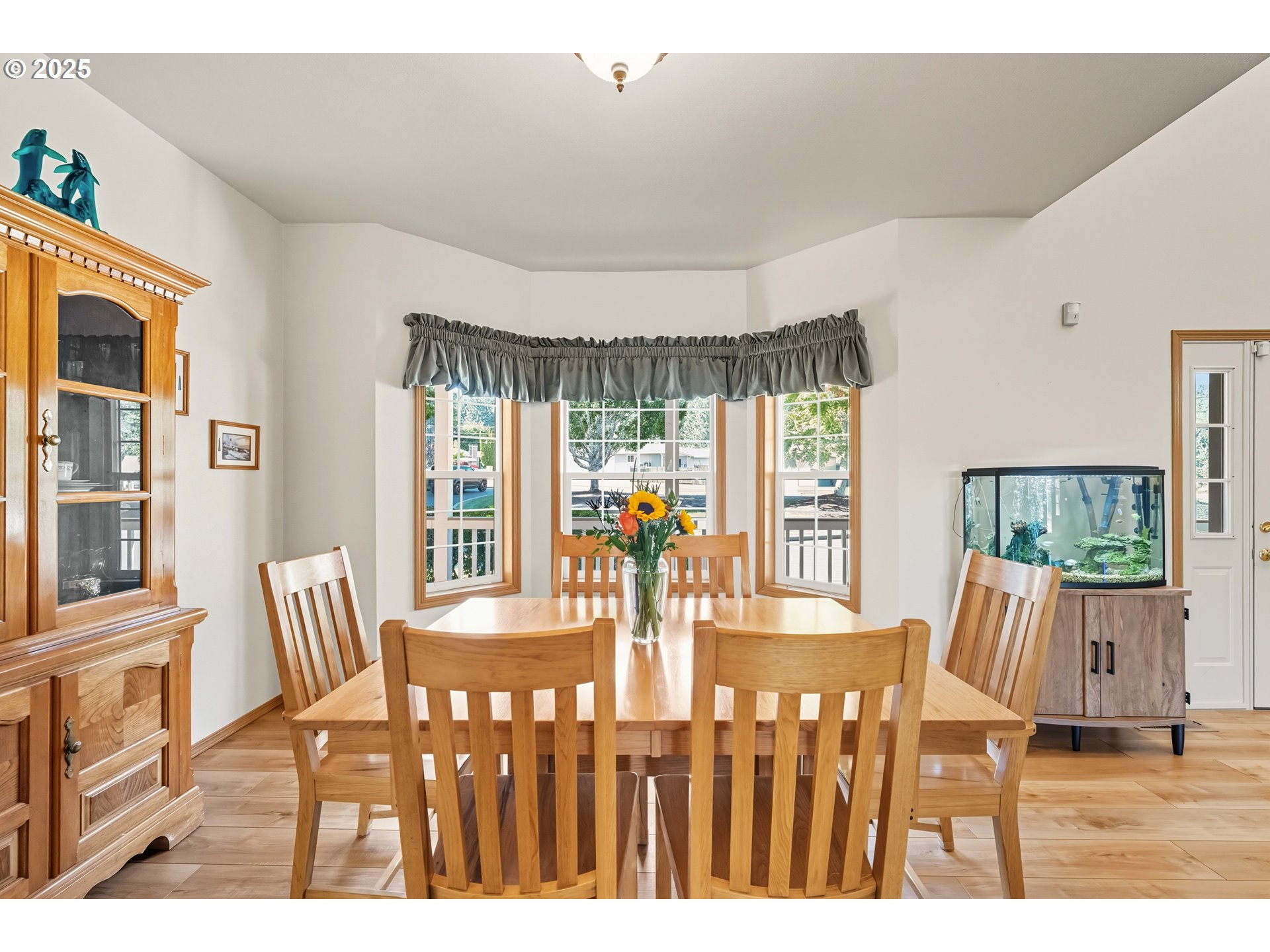 729 Ranch Road Reedsport, OR 97467 - Photo 26 of 48 a view of a dining room with furniture window and wooden floor
