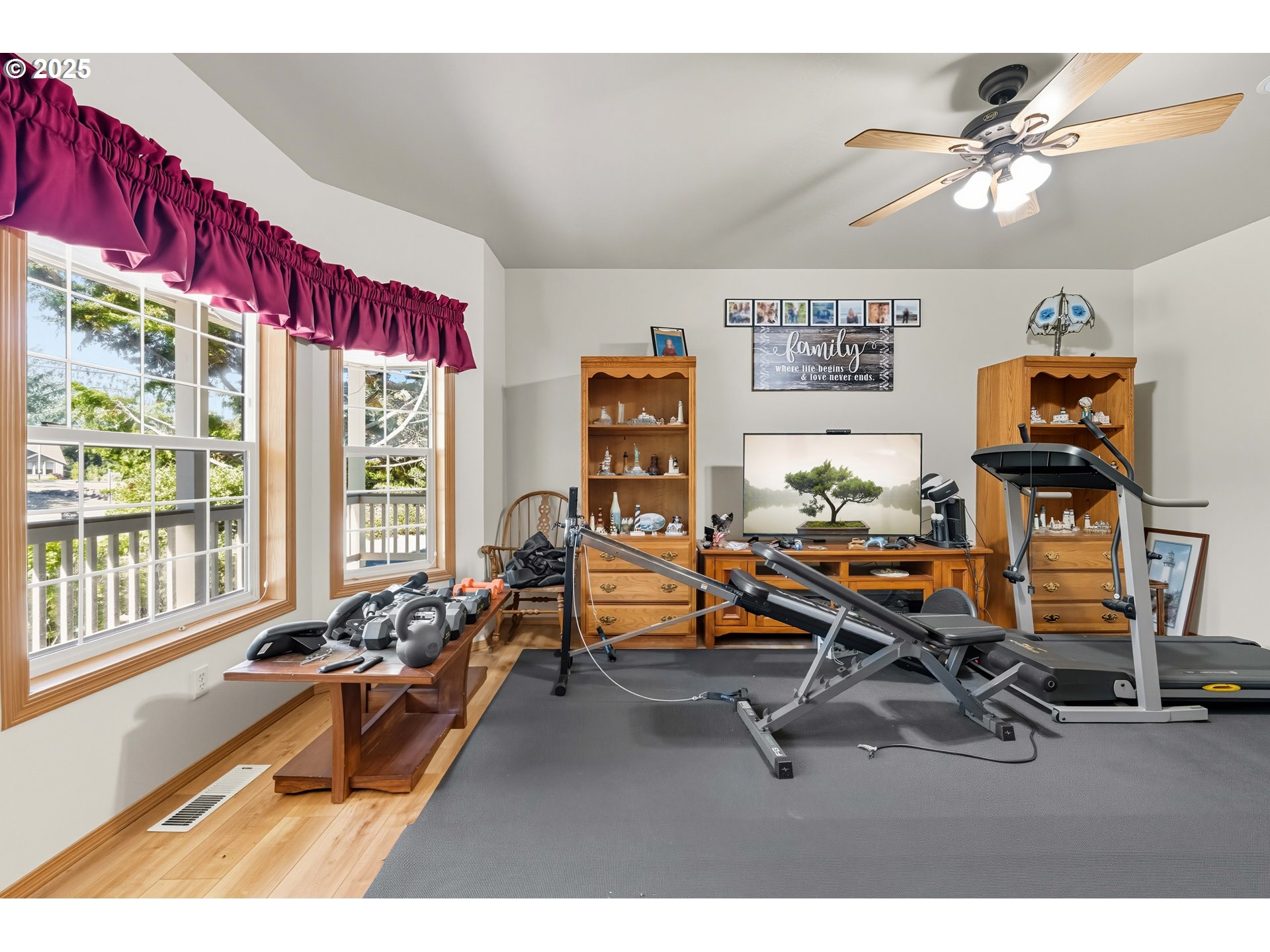 729 Ranch Road Reedsport, OR 97467 - Photo 28 of 48 a living room with furniture gym equipment and a large window
