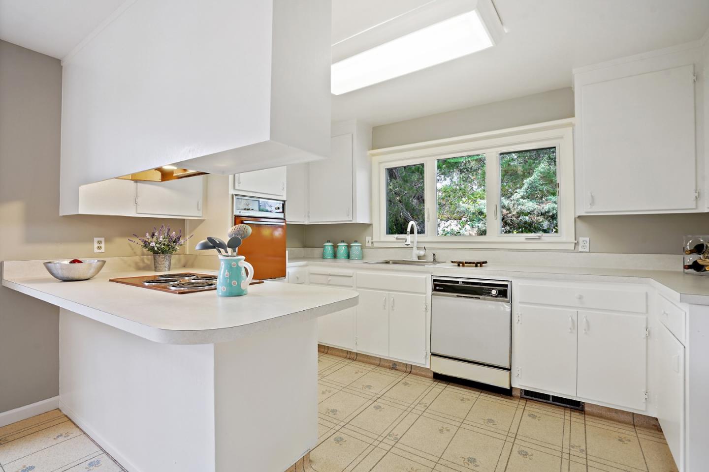 1511 Ridge Road Belmont, CA 94002 - Photo 21 of 50 a kitchen with appliances cabinets and a sink