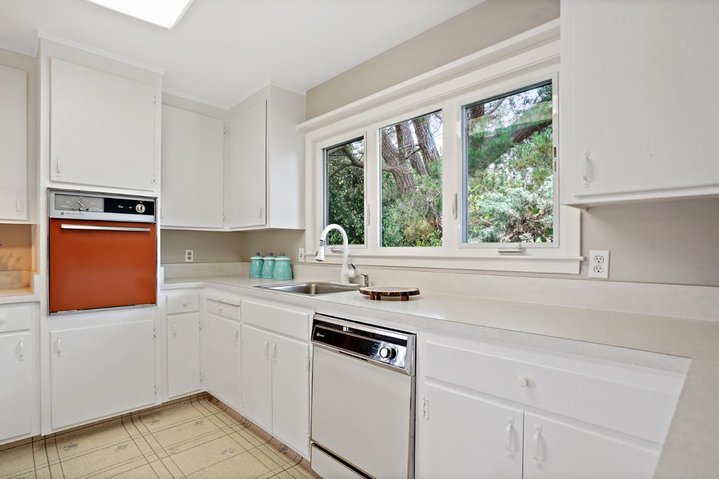1511 Ridge Road Belmont, CA 94002 - Photo 23 of 50 a kitchen with stainless steel appliances granite countertop a sink and a stove