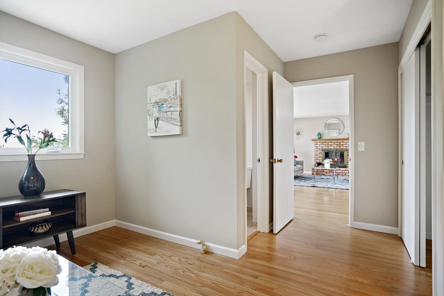 1511 Ridge Road Belmont, CA 94002 - Photo 33 of 50 a view of a hallway to a livingroom with wooden floor and a cabinet