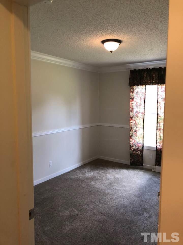 855 Chub Lake Loop Road Roxboro, NC 27574 - Photo 16 of 24 an empty room with windows
