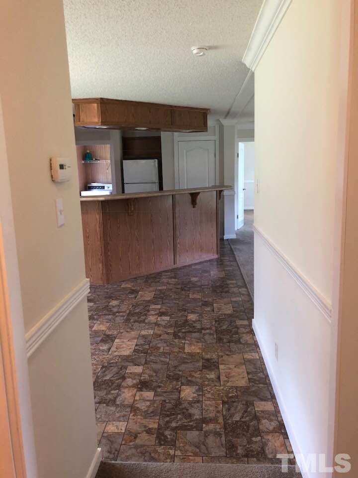 855 Chub Lake Loop Road Roxboro, NC 27574 - Photo 17 of 24 a view of a kitchen from the hallway