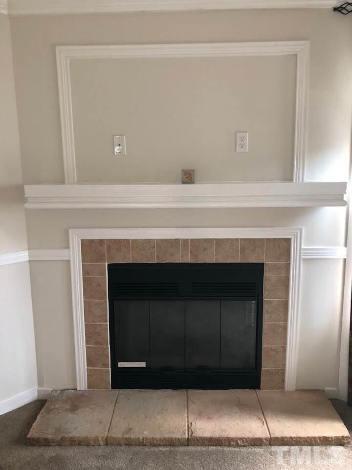 855 Chub Lake Loop Road Roxboro, NC 27574 - Photo 4 of 24 a fireplace with a hallway