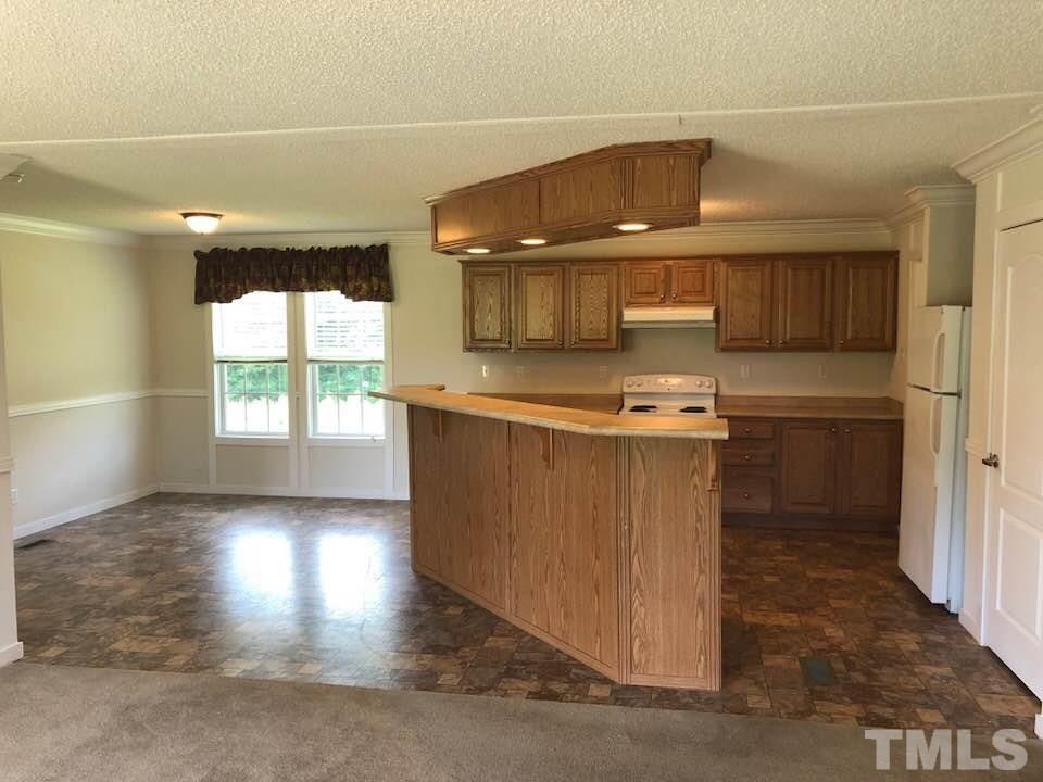 855 Chub Lake Loop Road Roxboro, NC 27574 - Photo 6 of 24 a kitchen with a cabinets and window