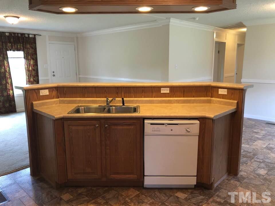 855 Chub Lake Loop Road Roxboro, NC 27574 - Photo 10 of 24 a bathroom with a sink and a mirror