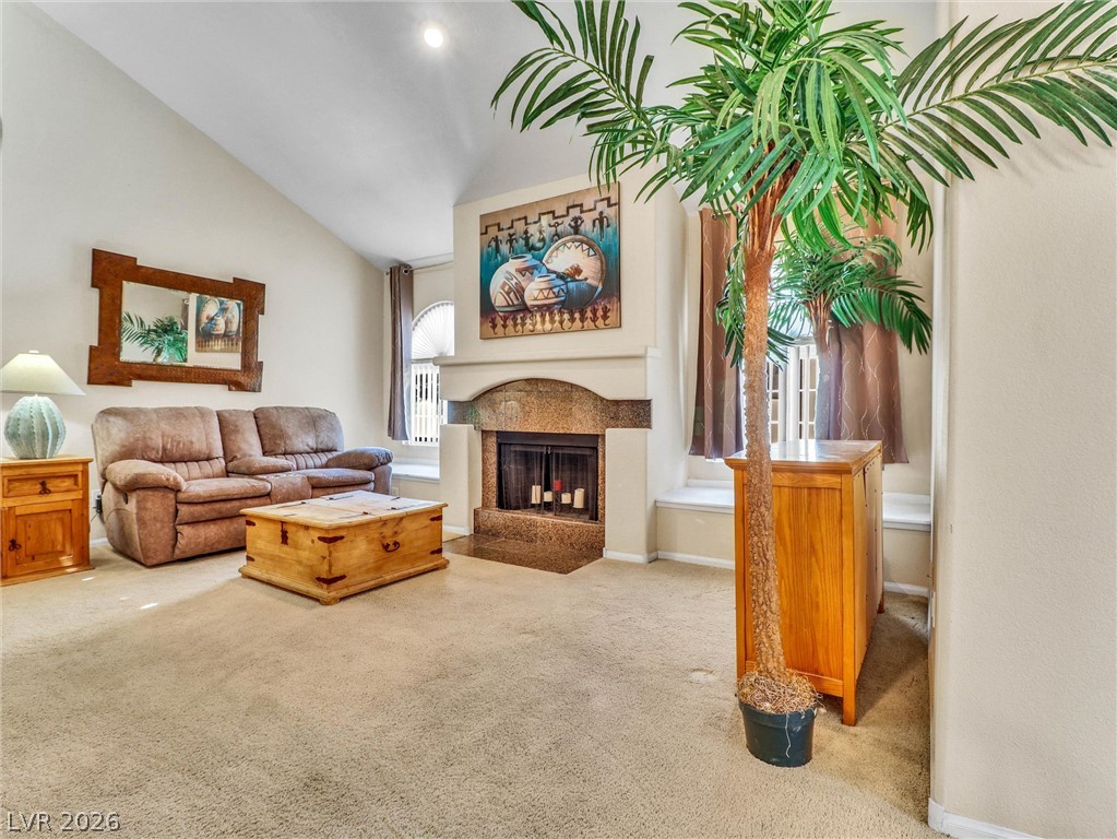 3145 East Flamingo Road, Unit 2129 Las Vegas, NV 89121 - Photo 5 of 43 A striking fireplace with rich stone accents anchors this spacious living area, crowned by soaring vaulted ceilings.