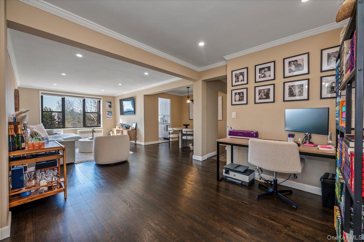 1 Remsen Road, Unit 4J Yonkers, NY 10710 - Photo 1 of 15 a living room with furniture and a wooden floor