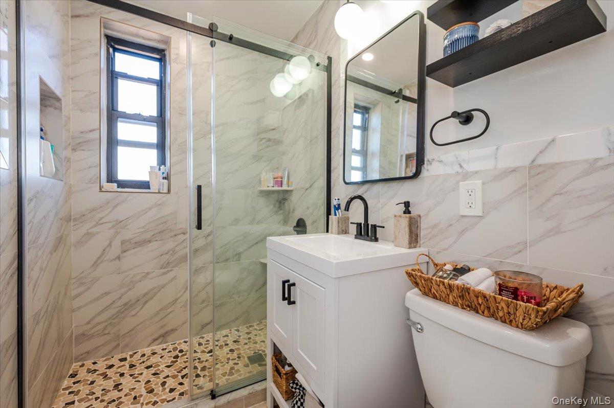 1 Remsen Road, Unit 4J Yonkers, NY 10710 - Photo 11 of 15 a bathroom with a sink toilet and shower